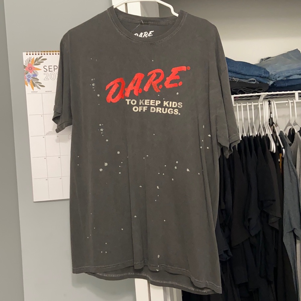 Never worn dare bleach spot shirt. Size L